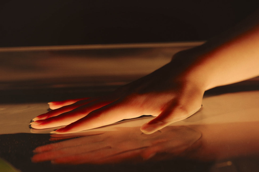 Hand touching glass