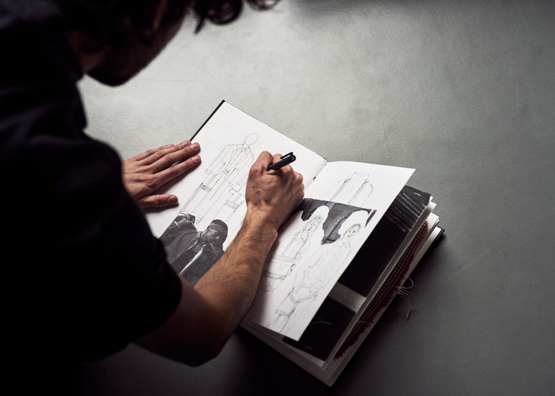 Man Drawing on drawing pad