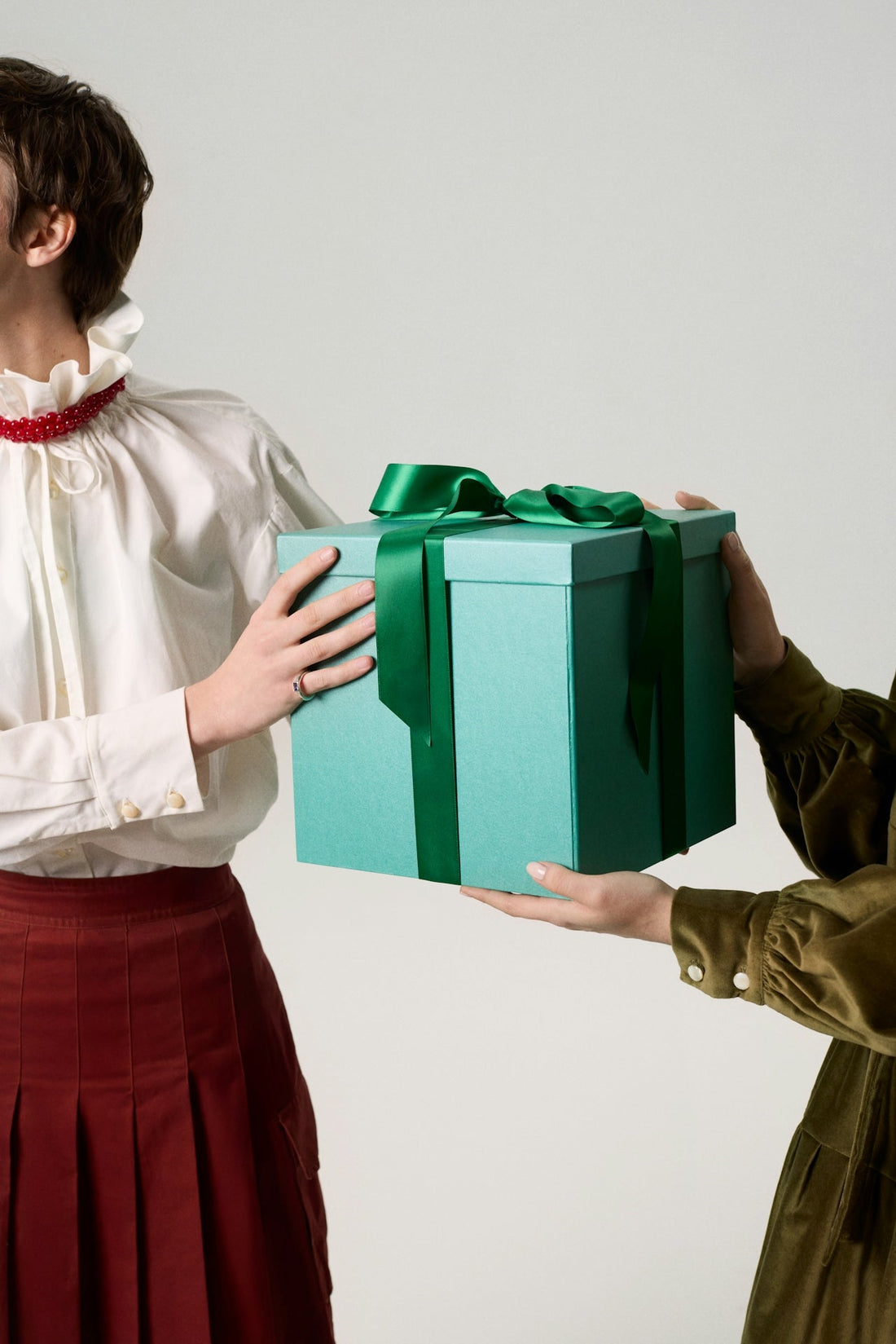 One lady giving a gift to another lady