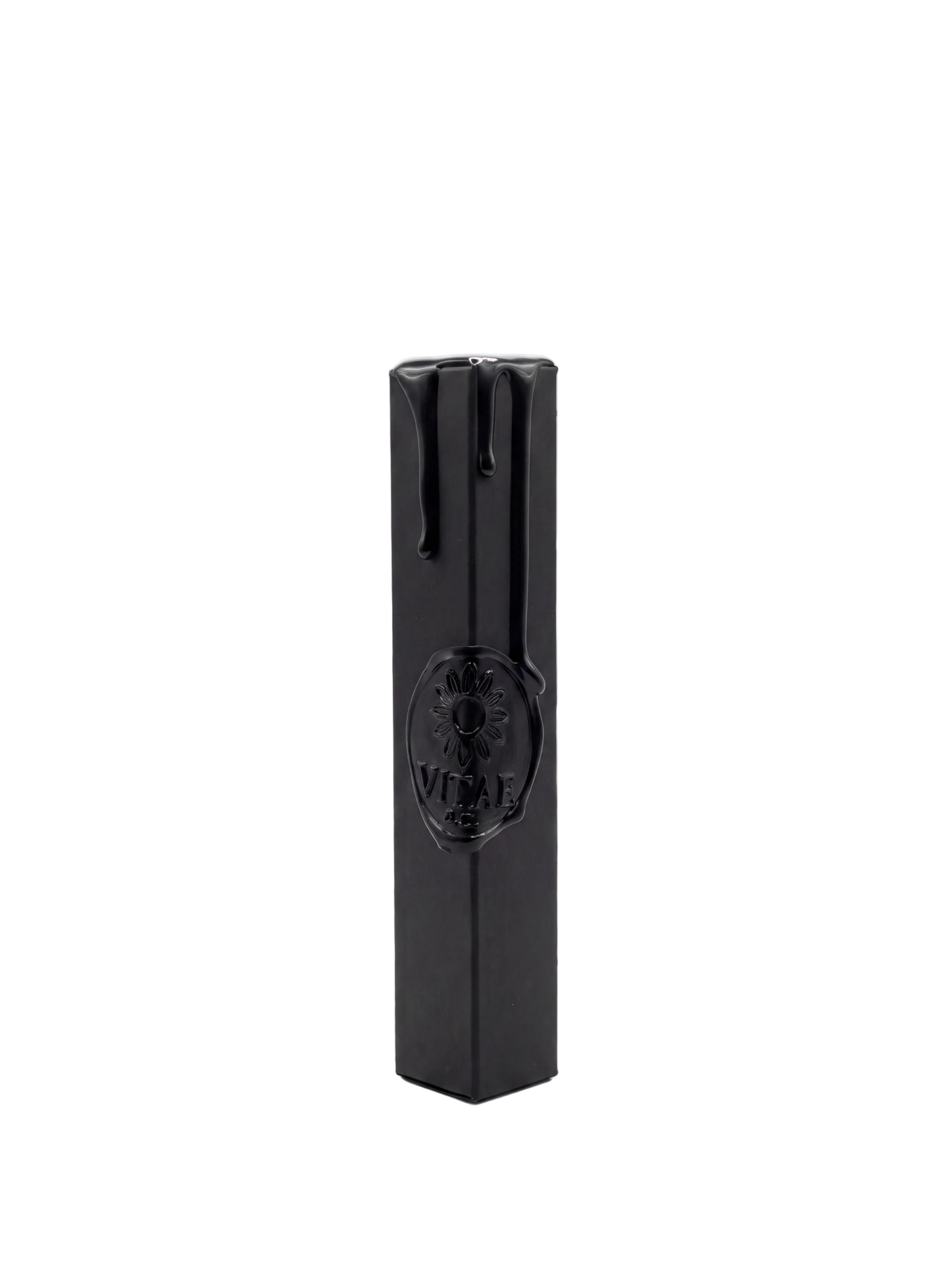 A black rectangular box with a glossy finish and a circular embossed logo on the front, standing upright on a white background.