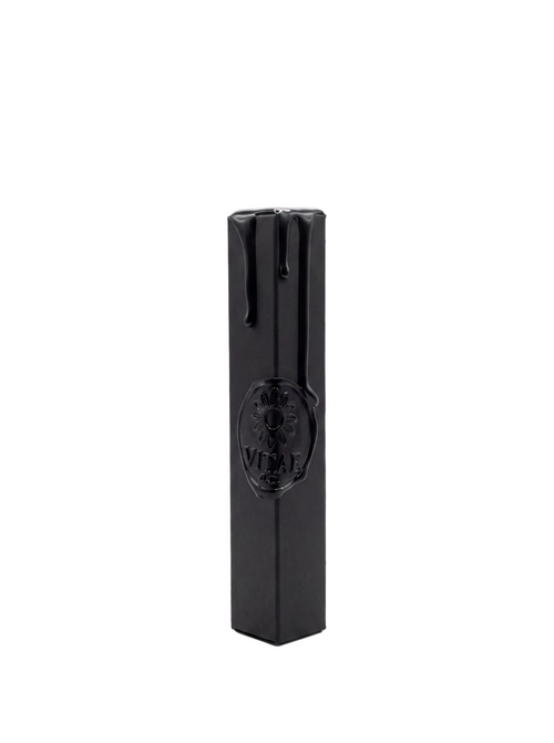 A black rectangular box with a glossy finish and a circular embossed logo on the front, standing upright on a white background.