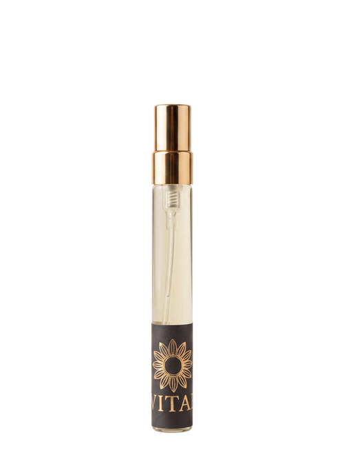 A clear glass perfume atomizer spray bottle with a shiny gold spray nozzle and a black label featuring a gold sunflower and the brand name VITA.