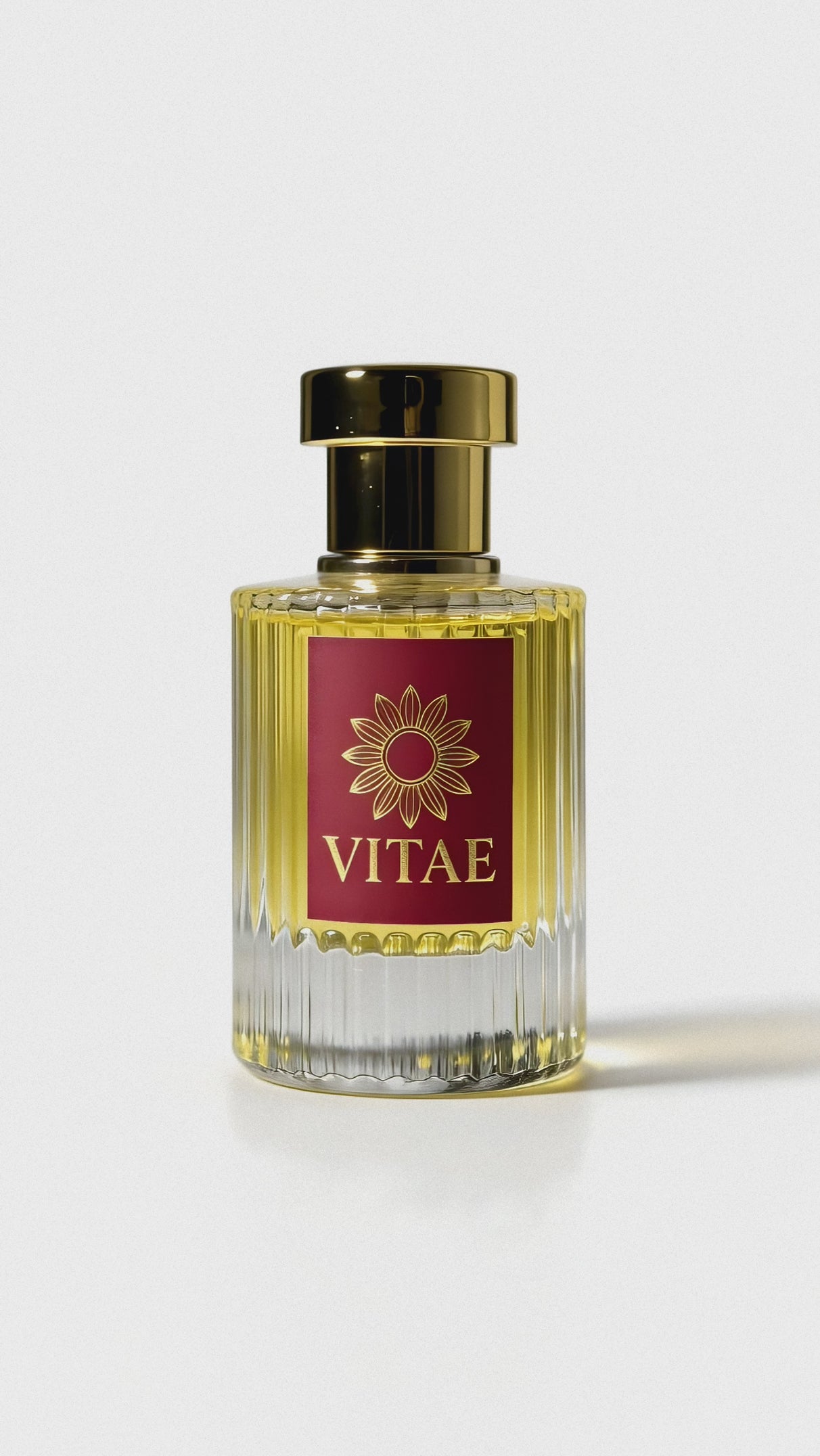 Vitae Red Parfum extrait de parfum bottle with gold cap and signature emblem rotating on white background